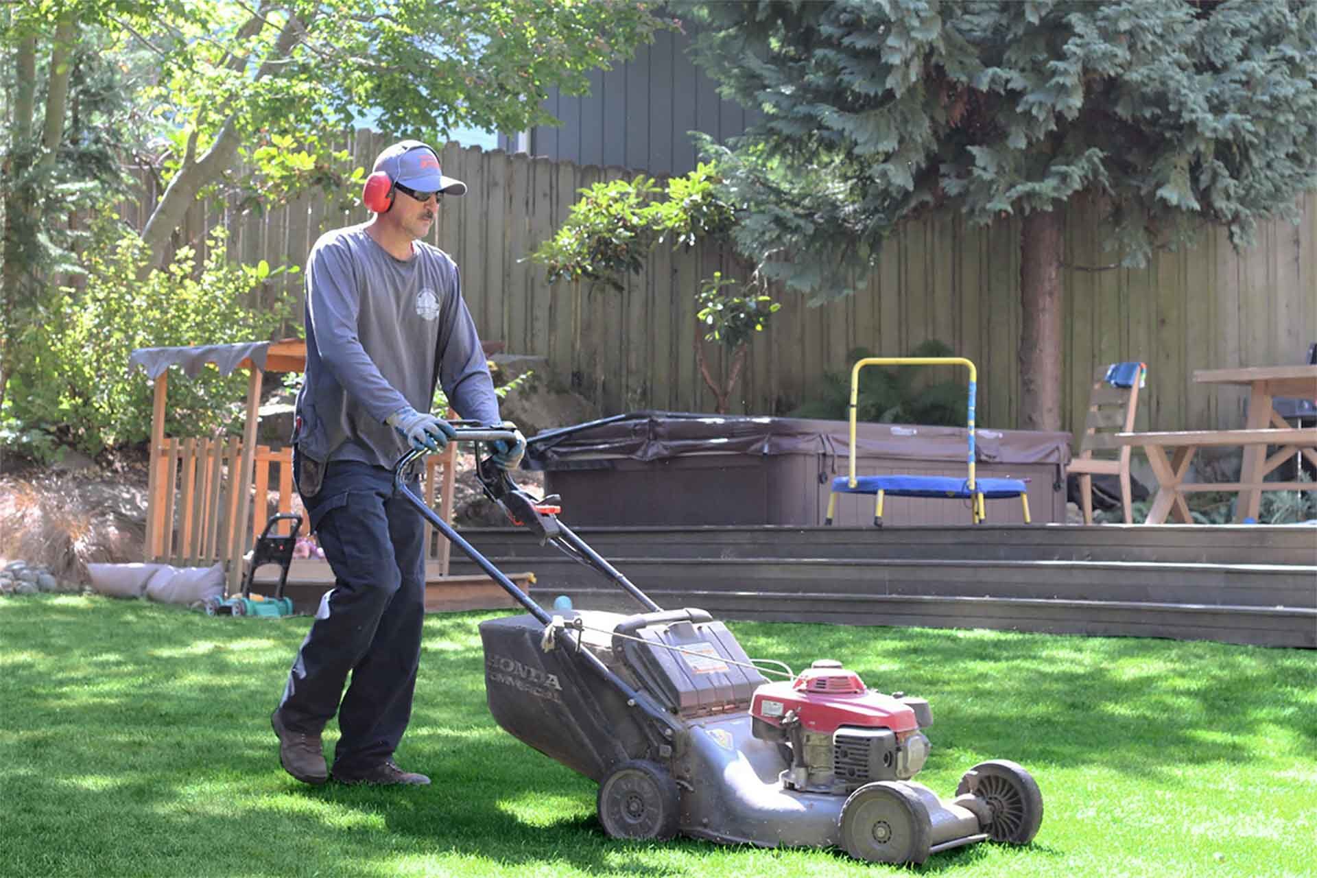 I Do Yard Maintenance crew trimming hedges along the Puget Sound waterfront in West Seattle